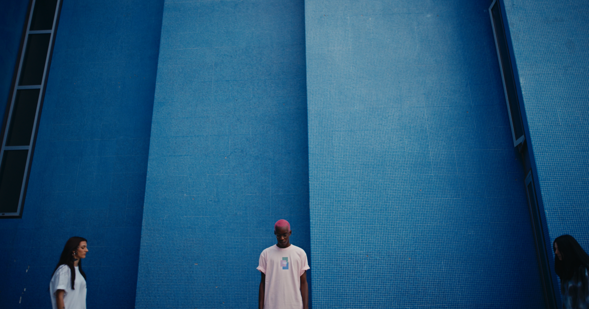3 models in white ELLEX PASTELLE oversized tee another in salmon coloured DAYDREAMING oversized box fit tee and a PASTELLE hoodie